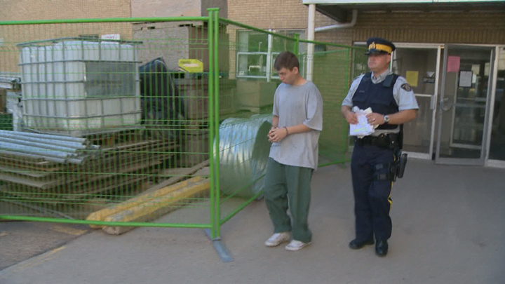 Shane Dale Pattison being led out of court after his child pornography conviction in 2012. He is now back in custody on new child pornography charges.