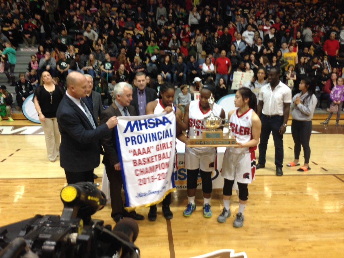 The Sisler Spartans celebrate their Provincial AAAA Girls Basketball title.