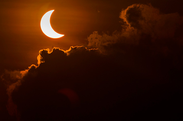 A partial solar eclipse is pictured from Indonesia on March 9, 2016. Canadians will be treated to a similar sight this summer.