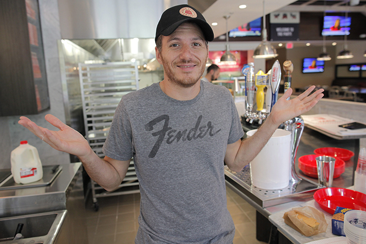 In this May 7, 2012 file photo, French-Canadian celebrity chef Spike Mendelsohn gestures at his new Good Stuff Eatery restaurant in Crystal City, Arlington, Va. 