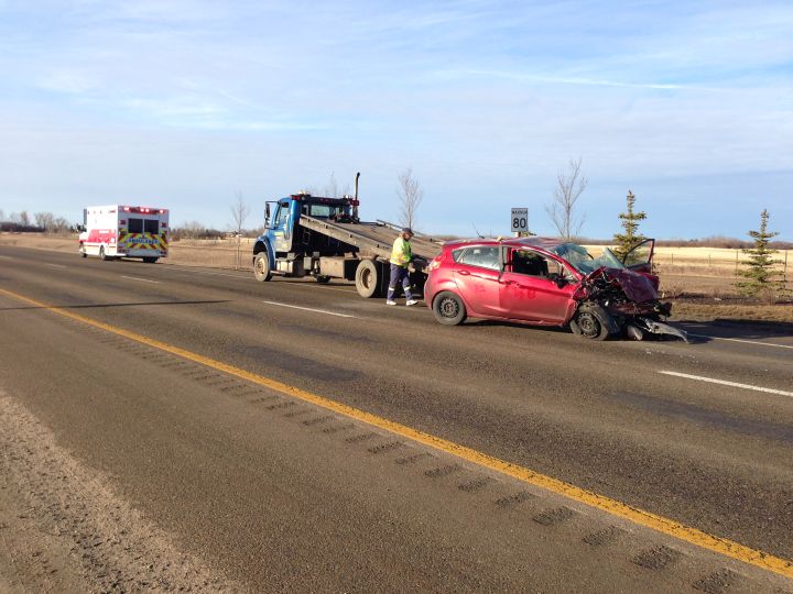 Woman in hospital after vehicle crashes through St. Albert sign