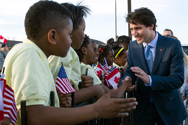 Prime Minister Justin Trudeau greets students from D.C.'s Patterson Elementary School after he arrived at Andrews Air Force Base, Md. on Wednesday, March 9, 2016. 