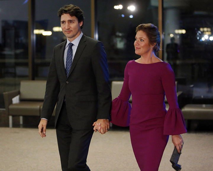 Prime Minister Justin Trudeau, left, and his wife Sophie Gregoire-Trudeau make their way to a dinner hosted for United Nations Secretary General Ban Ki-moon in Gatineau, Que., on Thursday, February 11, 2016. 