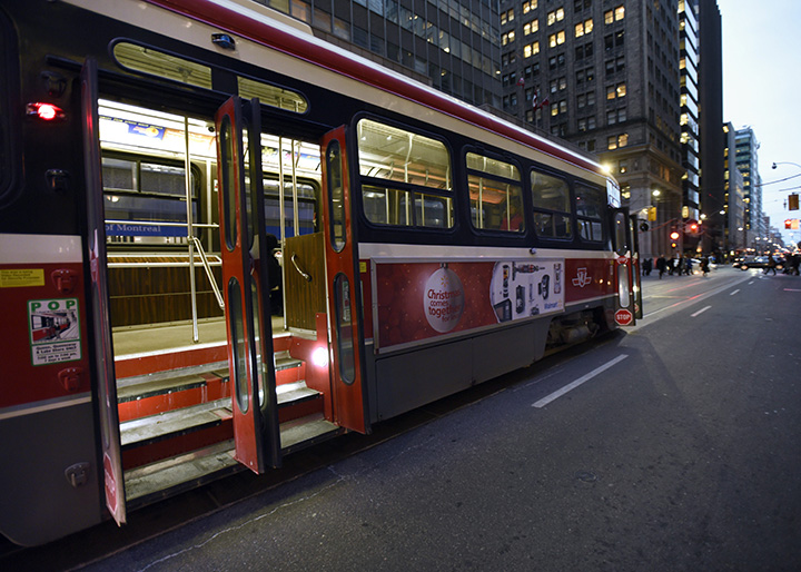 Commuters board a streetcar in downtown Toronto in this December 8, 2014 file photo. 