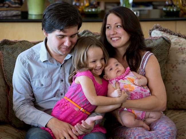 In this 2014 file photo, award-winning concert pianist Vadym Kholodenko, poses with his wife Sofya Tsygankova and daughters Nika, 4, and Michela, at their home in Fort Worth, Texas.