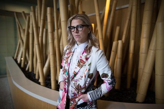 Former WestJet flight attendant Mandalena Lewis stands for a photograph in Vancouver, B.C., March 8, 2016.