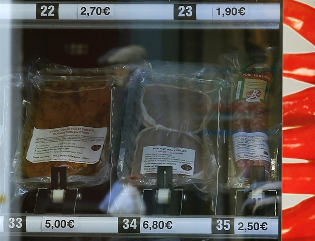 A close up of the first meat vending machine installed in the French capital, in Paris, Tuesday, March 15, 2016. In a city filled with small shops where long lunches remain a crucial part of the 'French art de vivre' the gleaming red machine seems a bit incongruous.
