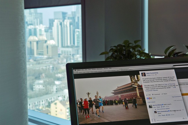 A computer screen displays the social media posting by Mark Zuckerberg on Facebook in Beijing, China, Friday, March 18, 2016. 