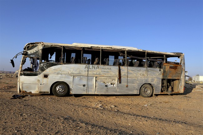 A bus damaged after a crash carrying Palestinian pilgrims en route to Saudi Arabia, on the outskirts of Maan, Jordan, Thursday, March 17, 2016. The number of Palestinian pilgrims killed when their bus overturned in a remote area of southern Jordan killed more than a dozen overnight, including many who had been pinned under the vehicle, officials said Thursday. (AP Photo/Raad Adayleh).