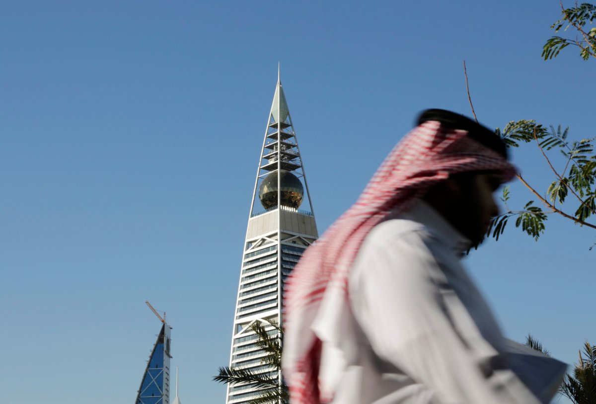 A Saudi man passes the al-Faisaliya tower in Riyadh, Saudi Arabia, Tuesday, Jan. 27, 2015. 