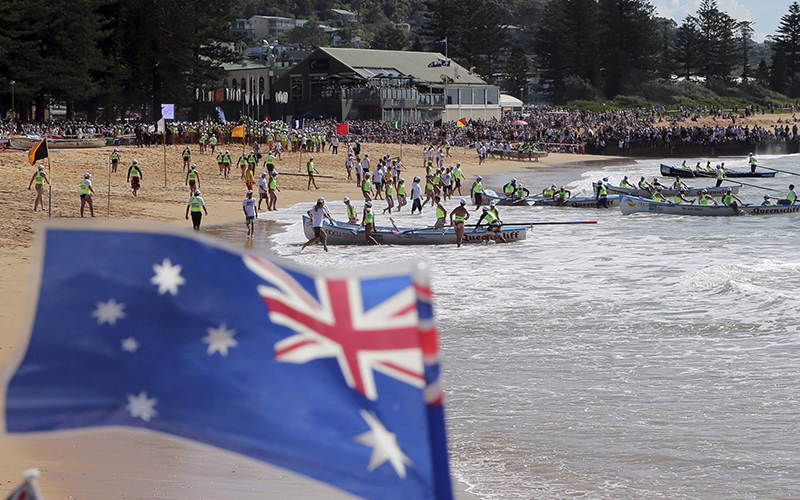 Surf boats arrive at Collaroy Beach during an ANZAC Day commemoration in Sydney, Australia, Saturday, April 25, 2015. 