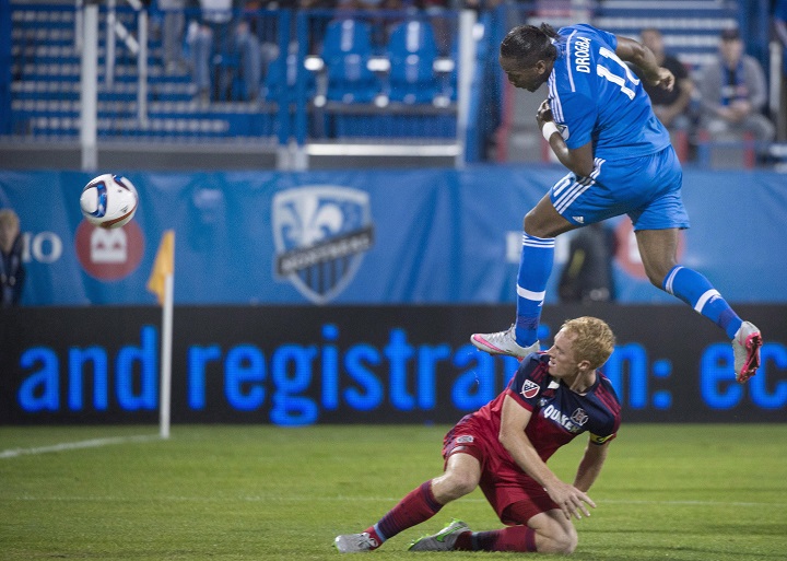 In this file photo, Montreal Impact's Didier Drogba (11) scores against Chicago Fire as Jeff Larentowicz looks on during first half MLS soccer action in Montreal,  Sepetember 23, 2015. Ignacio Piatti's late goal gives Montreal Impact 2-1 win over
Chicago in Brid
.