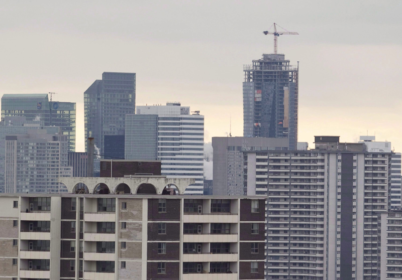 A construction crane sits atop a highrise building in Toronto in this file image. 