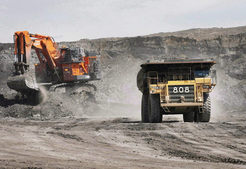 A haul truck carrying a full load drives away from a mining shovel at the Shell Albian Sands oilsands mine near Fort McMurray, Alta., Wednesday, July 9, 2008. Alberta lost more jobs last year than in any year since the 1982 recession, revised numbers from Statistics Canada show. THE CANADIAN PRESS/Jeff McIntosh.