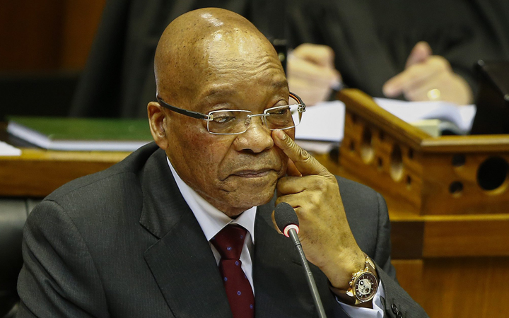 South African president Jacob Zuma reacts whilst answering questions from opposition parties in parliament, Cape Town, 06 August 2015. 
