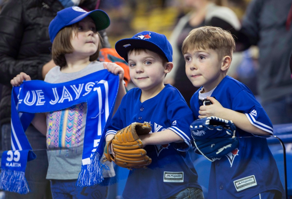 Chloe, 8, Zachary, 5, and Evan, 6, Thibault get ready to see the Toronto Blue Jays face the Boston Red Sox in spring training baseball action Friday, April 1, 2016 in Montreal.