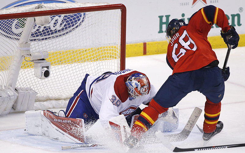 Florida Panthers right wing Jaromir Jagr shoots against Montreal Canadiens goalie Mike Condon during the third period of an NHL hockey game, Saturday, April 2, 2016, in Sunrise, Fla. 