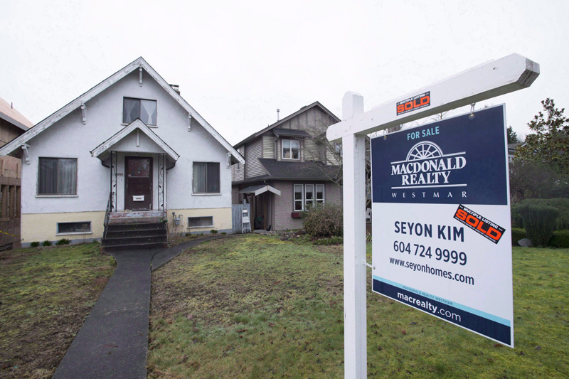 A sold home is pictured in Vancouver, B.C., Thursday, Feb. 11, 2016. 