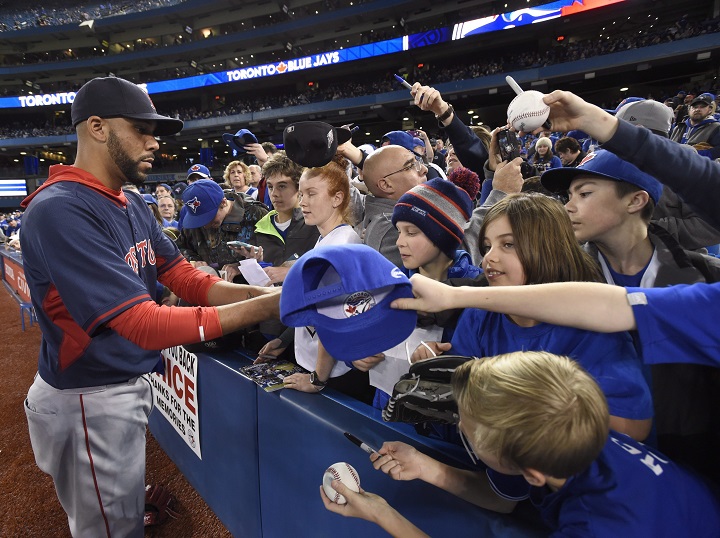 Boston Red Sox pitcher David Price signs autographs for fans before the start of Toronto Blue Jays AL home opener against the Red Sox in Toronto on Friday April 8, 2016. 