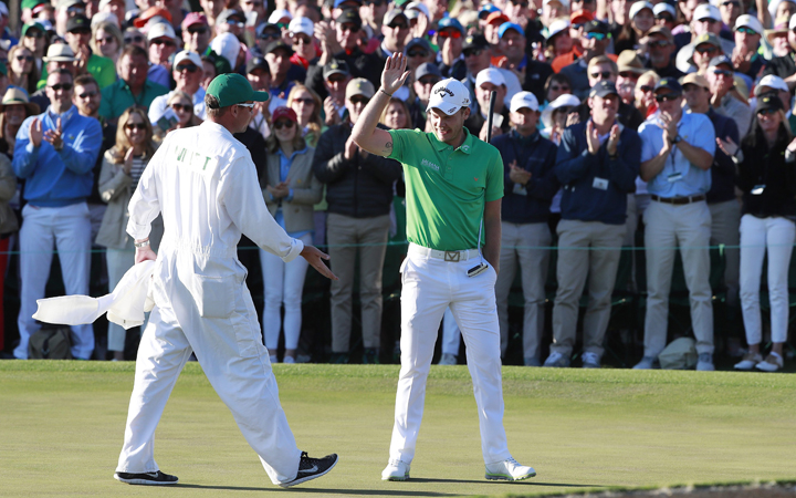 Danny Willett of England reacts with his caddie Jonathan Smart after his final putt on the eighteenth hole during the final round of the 2016 Masters Tournament at the Augusta National Golf Club in Augusta, Georgia, USA, 10 April 2016. 