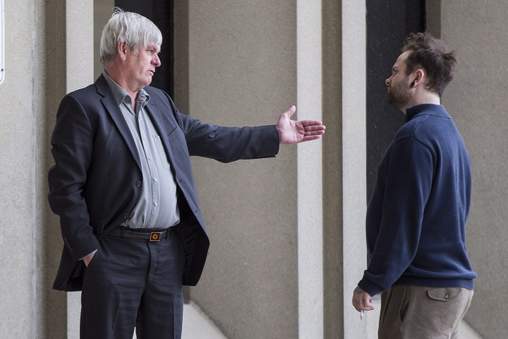 Scott Fraser (left), whose son Alex Fraser was killed by James McCullough at a London, Ont. hotel in September of 2013 takes a break from proceedings in McCullough's trial at the courthouse in London, Ontario, Monday, April 25, 2016.
