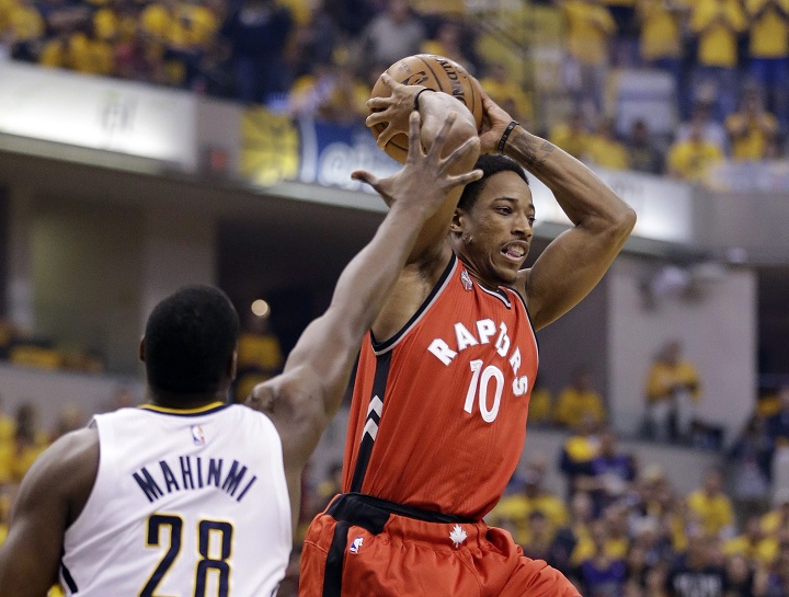 Toronto Raptors' DeMar DeRozan (10) passes against Indiana Pacers' Ian Mahinmi (28) during the first half of Game 6 of an NBA first-round playoff basketball series Friday, April 29, 2016, in Indianapolis.