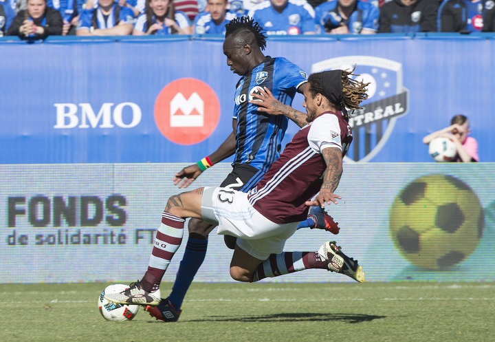 Montreal Impact forward Dominic Oduro and Colorado Rapids midfielder Jermaine Jones challenge for the ball during first half MLS action Saturday, April 30, 2016 in Montreal.