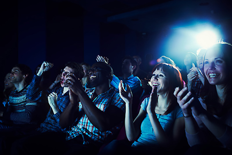 Audiences enjoy a movie