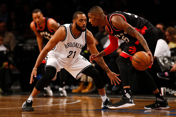 Wayne Ellington #21 of the Brooklyn Nets guards Delon Wright #55 of the Toronto Raptors during their game at the Barclays Center on April 13, 2016 in New York City. 
