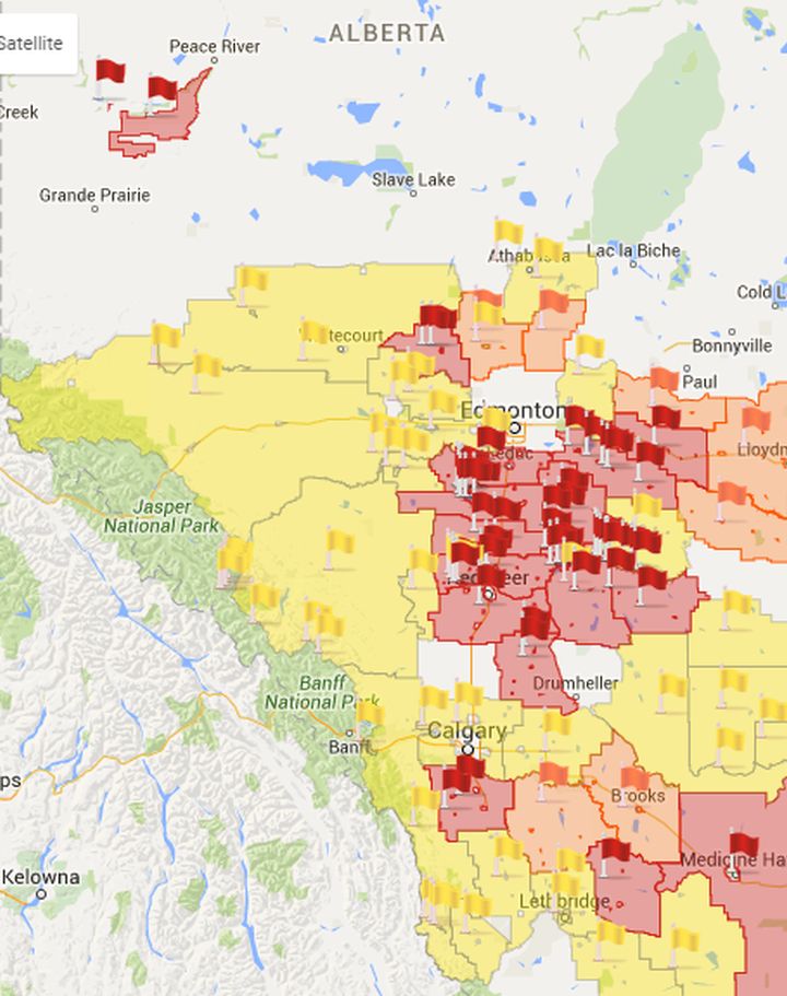 A map of Alberta showing where fire bands, restrictions and advisories are in place on April 17, 2016. The areas in red are under a fire ban, the areas in orange are under a fire restriction and the areas in yellow are under a fire advisory.