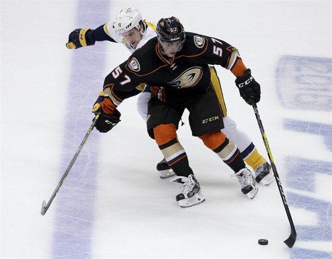 Anaheim Ducks left wing David Perron, right, battles Nashville Predators center Filip Forsberg for the puck during the second period of Game 7 in an NHL hockey Stanley Cup playoffs first-round series in Anaheim, Calif., Wednesday, April 27, 2016. (.