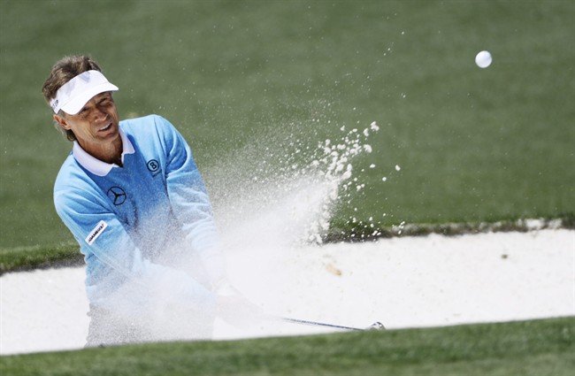 Bernhard Langer, of Germany, hits out of a bunker on the second green during the third round of the Masters golf tournament Saturday, April 9, 2016, in Augusta, Ga.