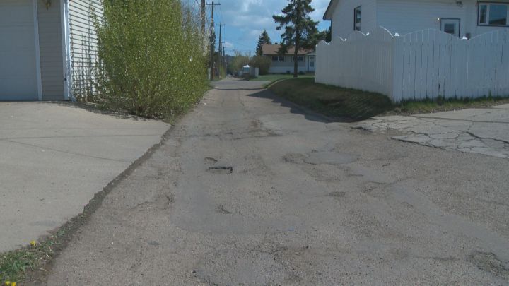 The city's Transportation Committee voted in favour of rolling the cost of back alley repairs into the neighbourhood renewal program