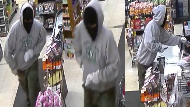 A man brandishing a knife made off with cash from a Battleford, Sask. business.