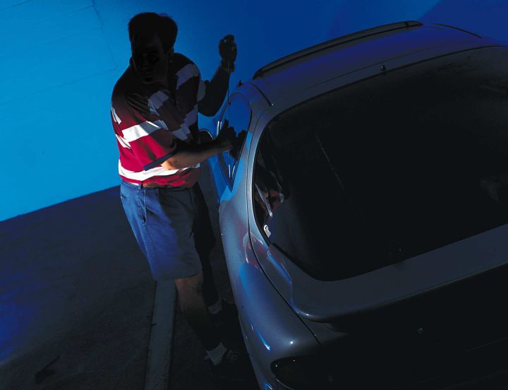A photograph illustrating a car break-in.