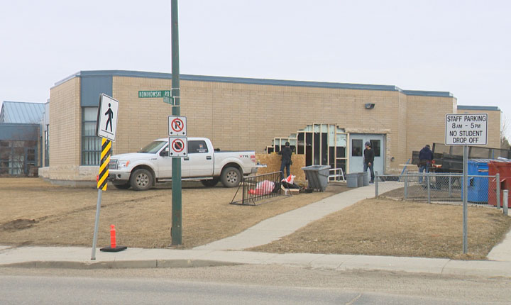 Saskatoon police say charges are pending after a car crashed into a school early Sunday morning.