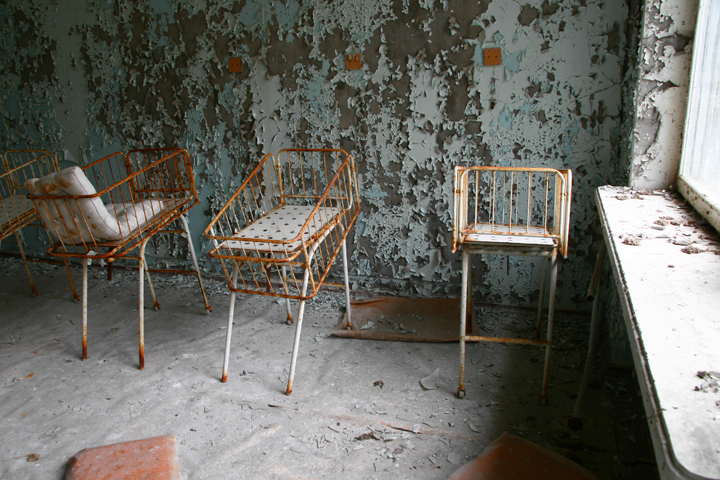 Rusted out cribs sit in a hospital in Pripyat, Ukraine.