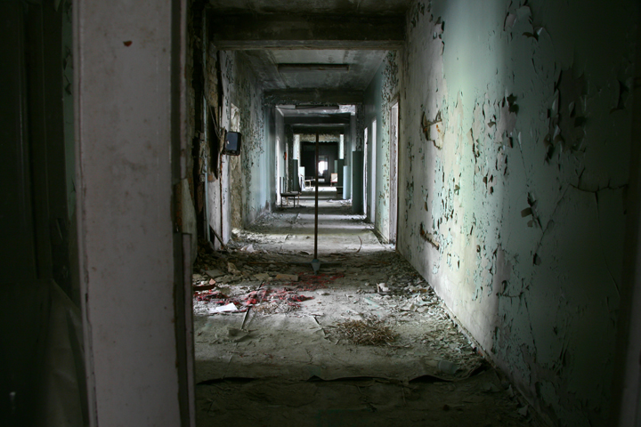 Radioactive paint peels from hospital hallway walls in Pripyat, Ukraine.