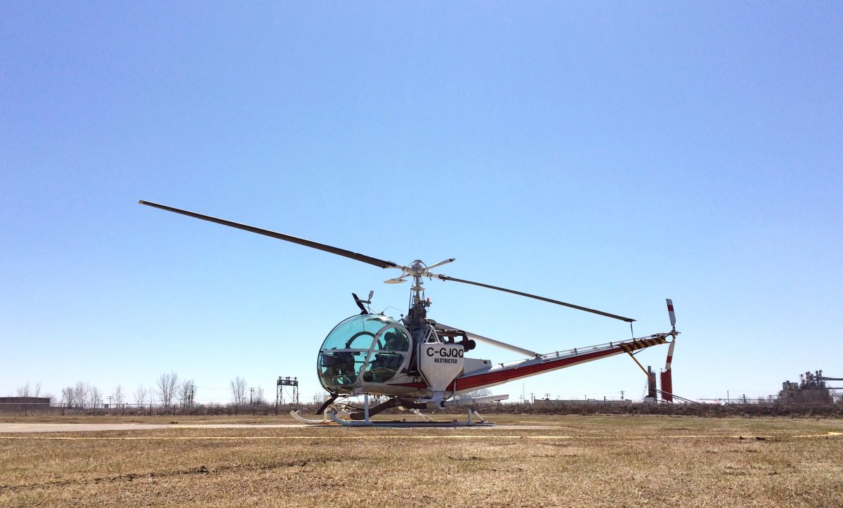 One of the city's four insect control helicopters getting prepared Thursday afternoon. 