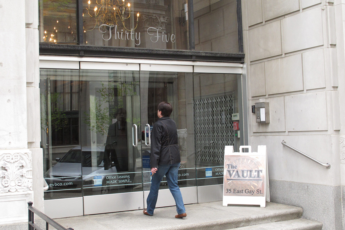 A woman enters the downtown Commerce Building on Thursday, April 21, 2016, in Columbus Ohio. 