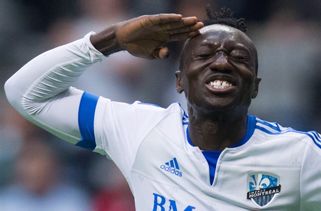 Montreal Impact's Dominic Oduro, of Ghana, celebrates his goal against the Vancouver Whitecaps during first half MLS soccer action, in Vancouver on Sunday, Mar. 6, 2016.