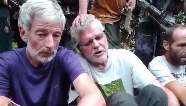 Canadians Robert Hall, left, and John Ridsdel are seen in this still image taken from an undated militant video.