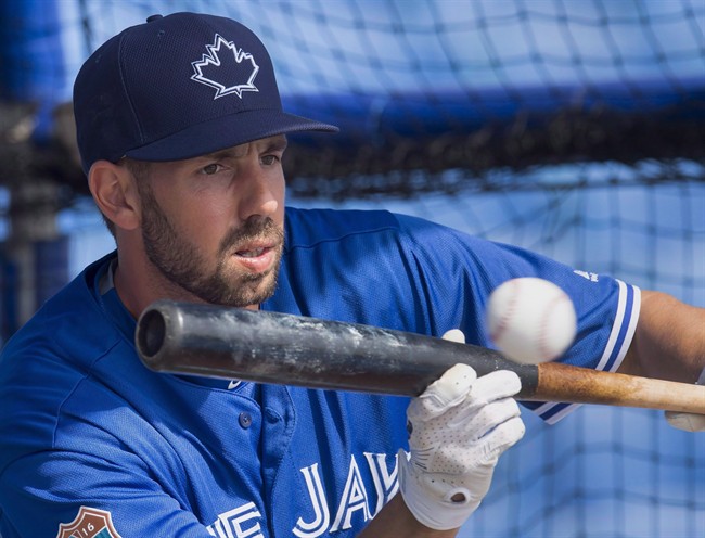 Toronto Blue Jays first baseman Chris Colabello lays down a bunt during batting practice at spring training in Dunedin, Fla., on Wednesday, March 2, 2016. Colabello has been suspended for 80 games without pay after testing positive for a performance-enhancing substance. 