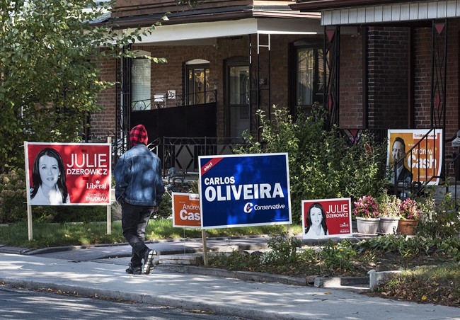 Campaign signs are seen on lawns in the Toronto riding of Davenport on Canada's federal election day on Monday, Oct. 19, 2015.
