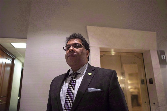 Calgary Mayor Naheed Nenshi waits to speak to the media as he the attends Big Cities summit hosted by the Federation of Canadian Municipalities in Toronto on February 5, 2015.