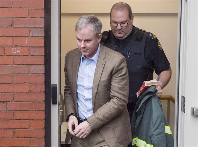 Dennis Oland heads from the Court of Appeal in Fredericton, N.B. on Monday, March 7, 2016.