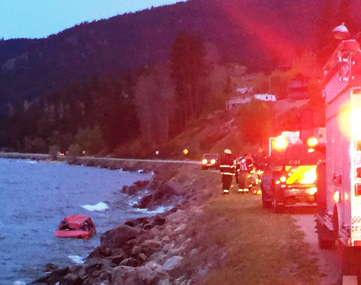 A bystander pulled a crash victim from a wrecked car in Okanagan Lake Thursday night. 