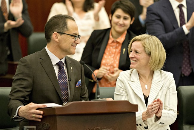 Alberta Premier Rachel Notley smiles as Minister of Finance Joe Ceci delivers the 2016 budget in Edmonton on Thursday April 14, 2016. 