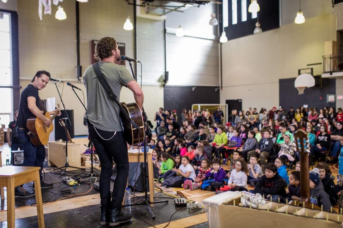 Singer Jonas and guitarist Corey Diabo perform at Kahnawake Survival School, Wednesday, March 23, 2016.