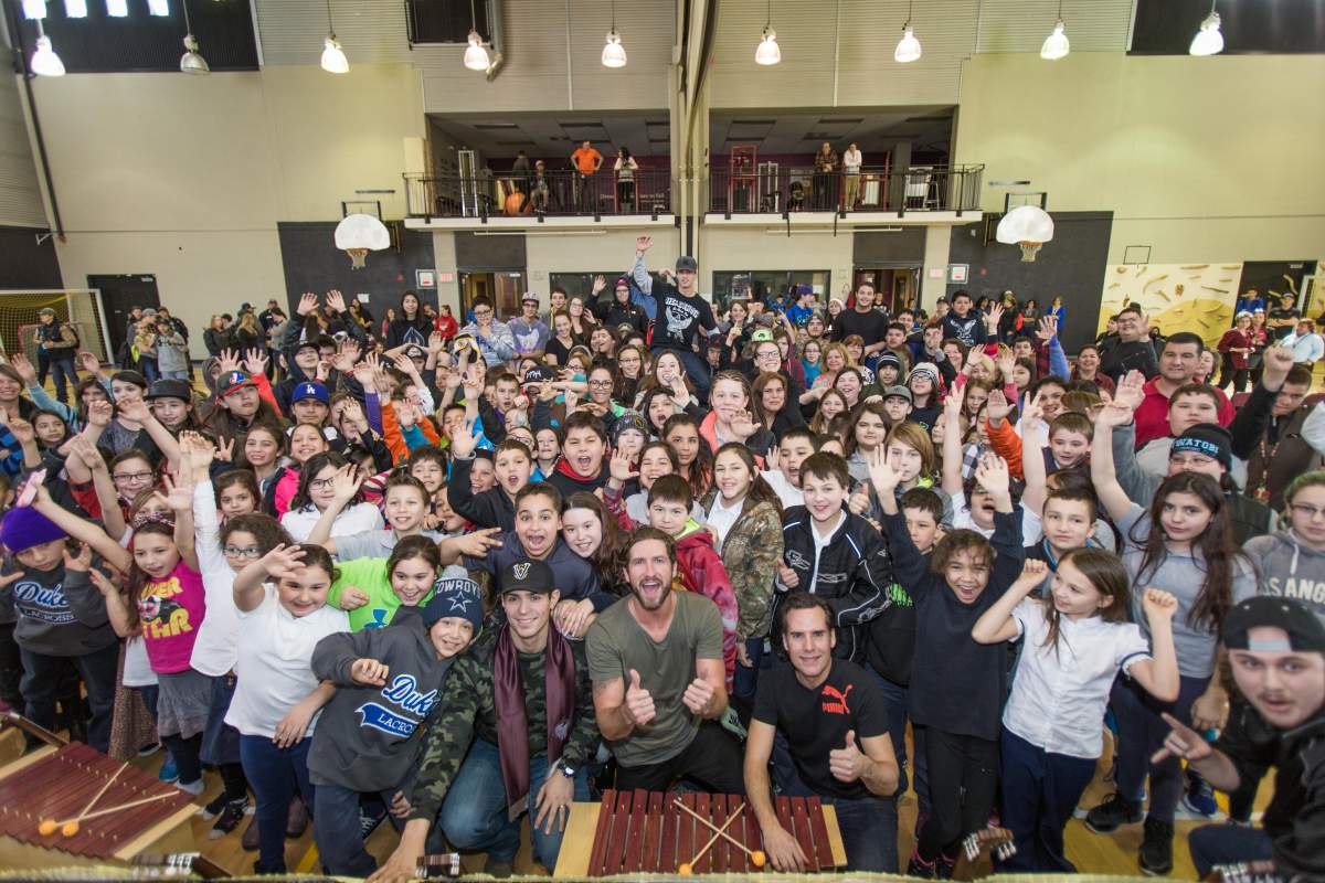 Singer Jonas, guitar player Corey Diabo and Montreal Canadiens goaltender Carey Price visit students at Kahnawake Survival School , Wednesday, March 23, 2016.
